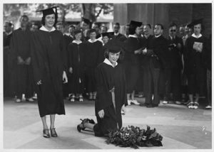 Two students from 1939 graduating senior class laying a wreath on Memorial Tower’s arcade floor in honor of fallen World War I soldiers and sailors. Many members of this class would fight and die in World War II. Courtesy University Archives.