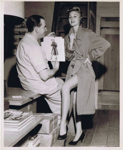 In a Chicago Sun-Times publicity shot, Caniff poses with a model who was allegedly the inspiration for the Miss Mizzou character. Caniff later claimed the inspiration was Marilyn Monroe, but was threatened with a lawsuit by that actress for infringement of copyright. Caniff later claimed Miss Mizzou was patterned after a showgirl in New York. Courtesy Chicago Sun-Times Archives.