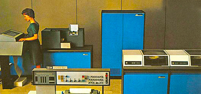 MU’s second computer was quantum leap in capability – a transistorized IBM 1440 data processing system inaugurated by the University Library in 1965. The MU alumni magazine of that year reported that librarians from around the world came to campus to see how the machine helped speed information management.  This computer, considered the precursor to the mainframe, had 16K of RAM, and could read up to 300 punch cards a minute. It cost $90,000. The 1440 evolved into the IBM 1443 that featured a “flying typebar printer” capable of typing 150 lines per minute. The last version of the computer, the IBM 1311, introduced in 1968, replaced the punch card system with a disk drive capable of holding 2 million characters of data. This was the computer used by MU atmospheric science. Courtesy IBM.