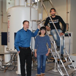The research team and the magnetic resonance spectrometer: Steven Van Doren, professor; Yan Fulcher, postdoctoral scholar; and Rama Koppisetti, research specialist. 