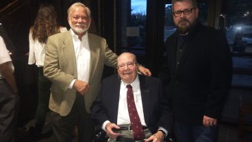 Alumn Richard Lane and retired professor Milton Bailey pose with Alan McClure, the first recipient of the Milton Bailey Graduate Student Support Fund.