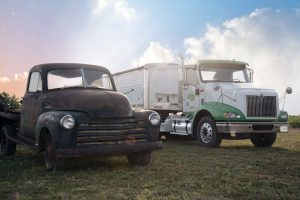 A truck from early days of Clay Farms sits next to its modern counterpart at the recent 200th anniversary celebration of the farm. Photo courtesy of Linda Nivens.
