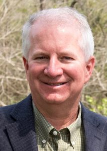 Photo of Rob Myers, white man with white hair wearing a navy sport coat