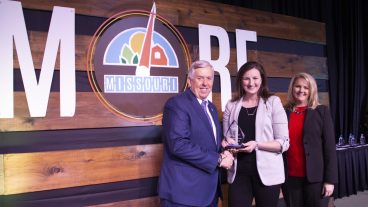 Christine Tew (center) was recently honored by the Missouri Department of Agriculture for her communication efforts, taking home the Ag Communicator of the Year award in January. Tew is pictured with Missouri Governor Mike Parson (left) and Missouri Department of Agriculture Director Chris Chinn. Photo courtesy of Missouri Department of Agriculture.