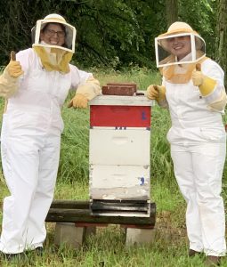Hundley-Whaley Superintendent Jennifer Miller (left) has brought honeybee research to the Center, as she looks for ways to build on small-acre entrepreneurship plots that are around five to 30 acres. Miller is pictured with Haleigh Karl, an intern at the Research Center.