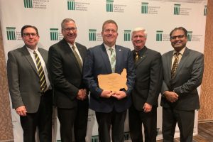 John Tummons receiving award