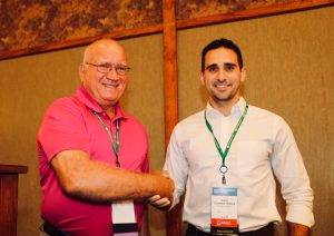 Caio Canella Vieira (right) is pictured here with Donn Cummings, former chair of the NAPB Borlaug Program, during the NAPB awards ceremony last year, where Canella Vieira received the Borlaug scholarship and first place in the research competition. Photo courtesy of Caio Canella Vieira.