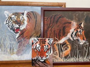Three paintings of tigers