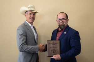Jared Decker receives the Continuing Service Award from the Beef Improvement Federation at the group's annual research symposium.