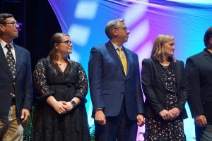 Honorees stand on stage