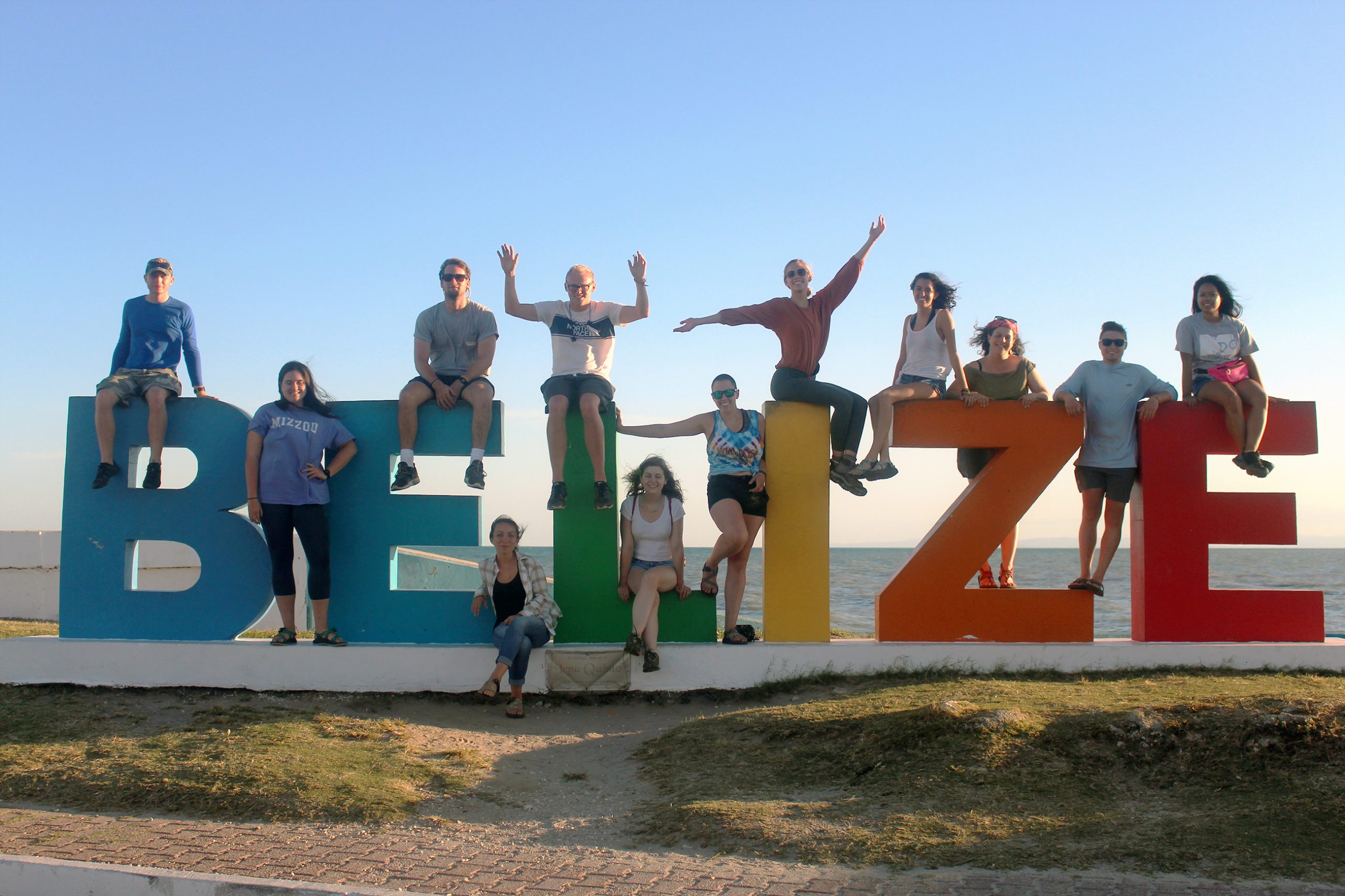 Students on Belize sign