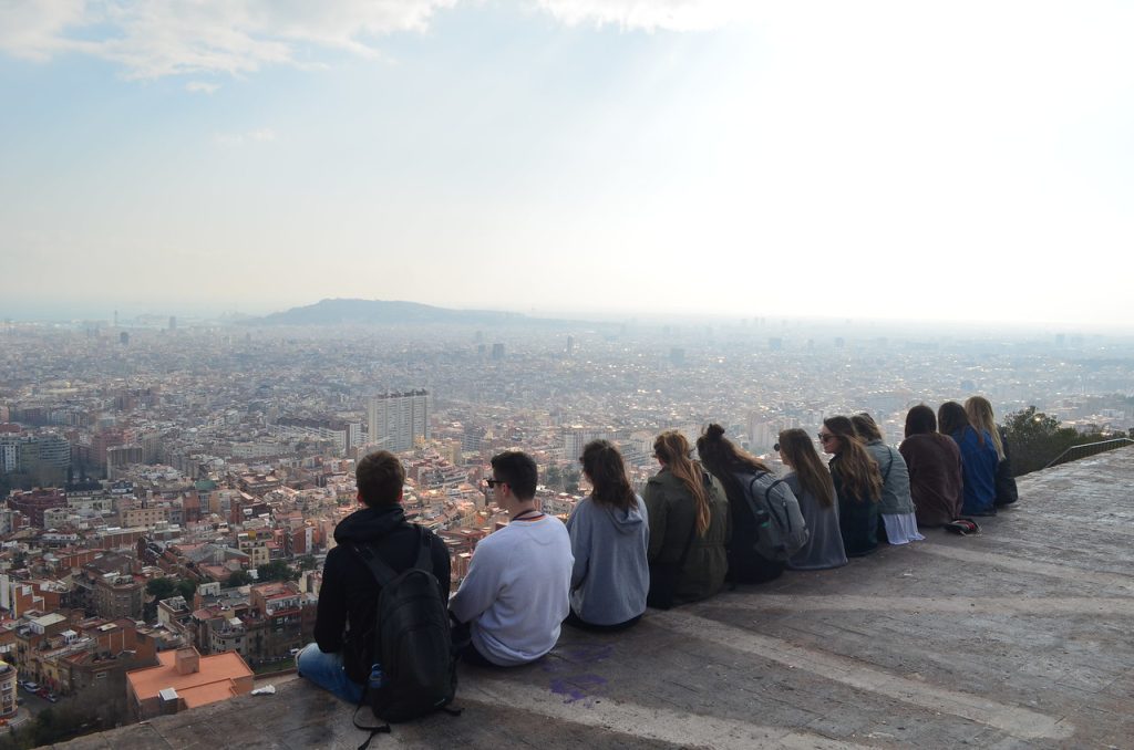 students looking out over a spanish city