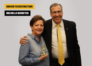 Dean and Michelle pose with award