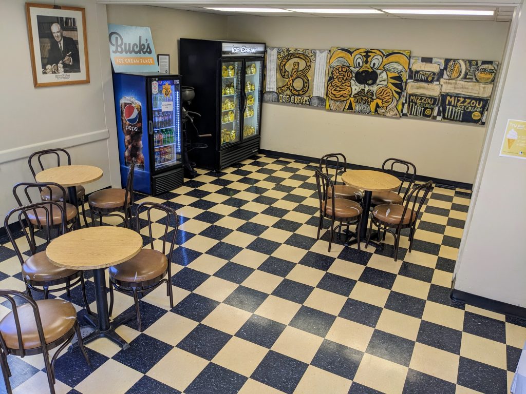 checkerboard flooring with Mizzou themed artwork on the walls