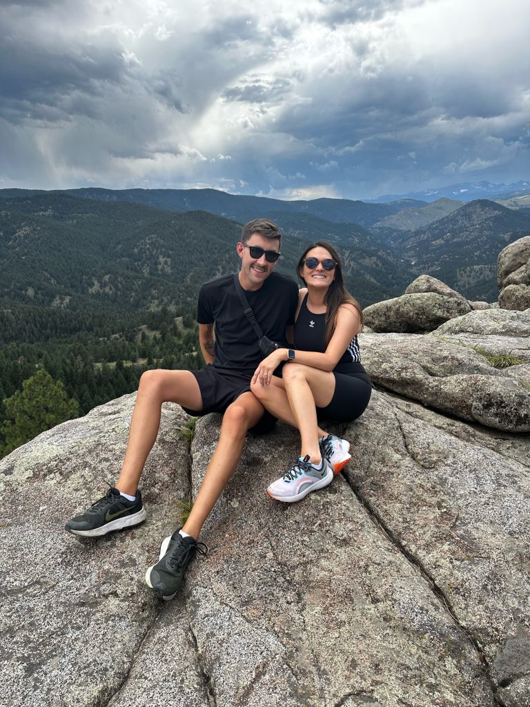 King and her husband Logan rock climbing. 