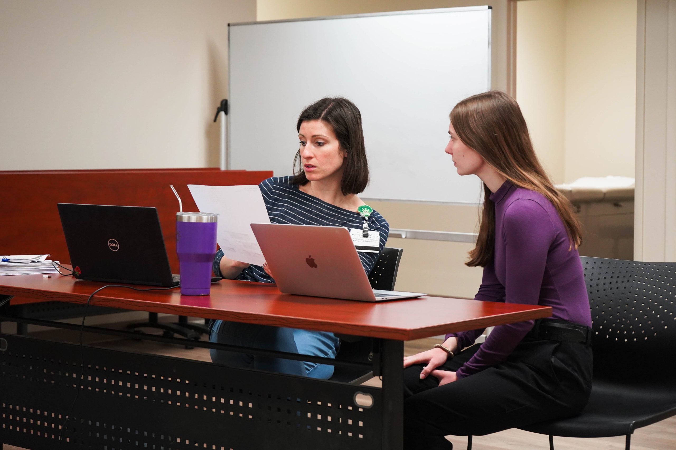 Jennifer Anderson consults with a dietetics student as they make a nutrition plan for their NutriZou client.