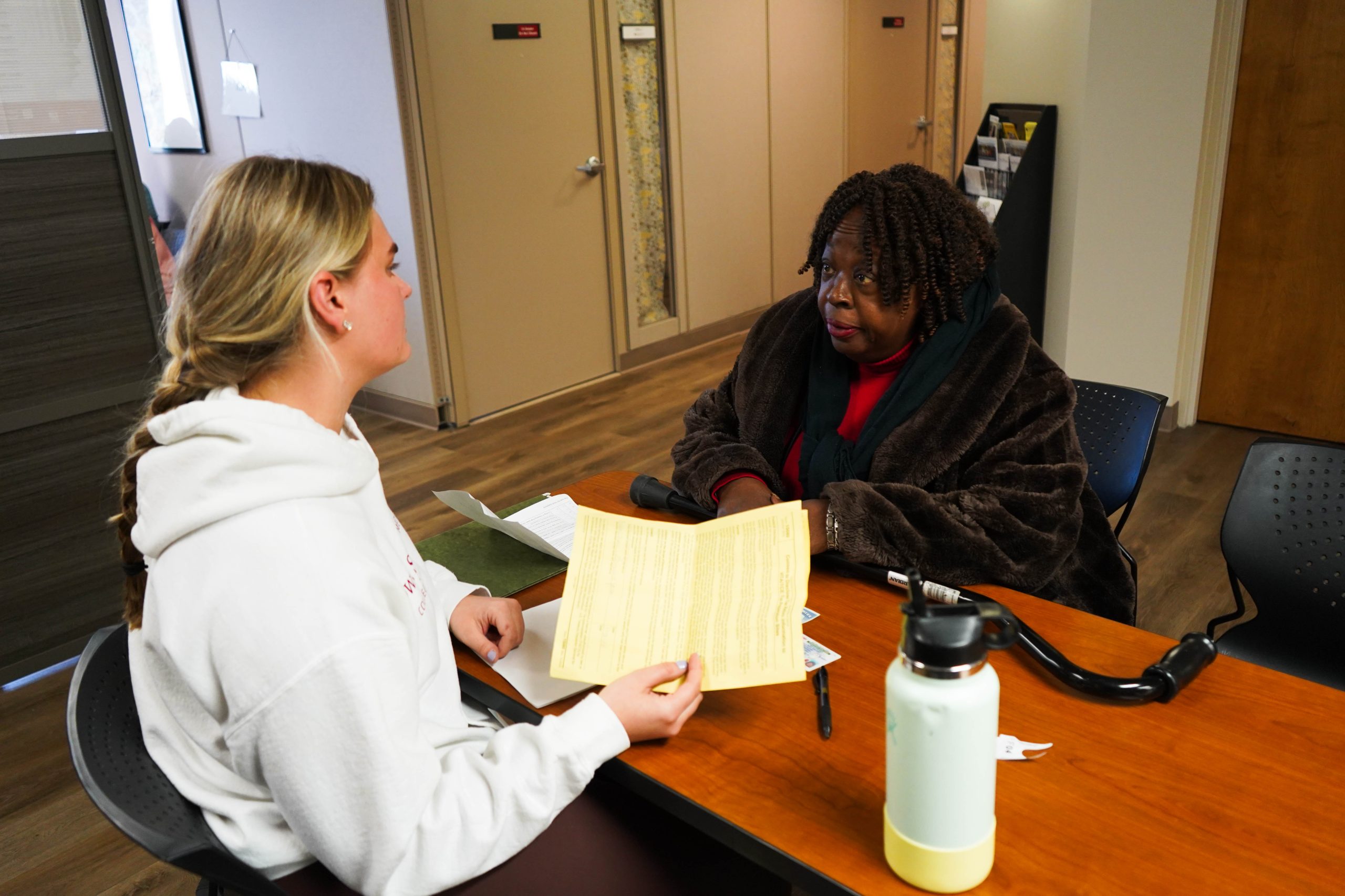 Personal Financial Planning student Sydney Kile helps Columbia resident Brenda Jones with her tax filing as part of the VITA tax prep service.