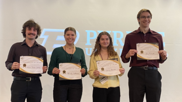 Winners holding certificates