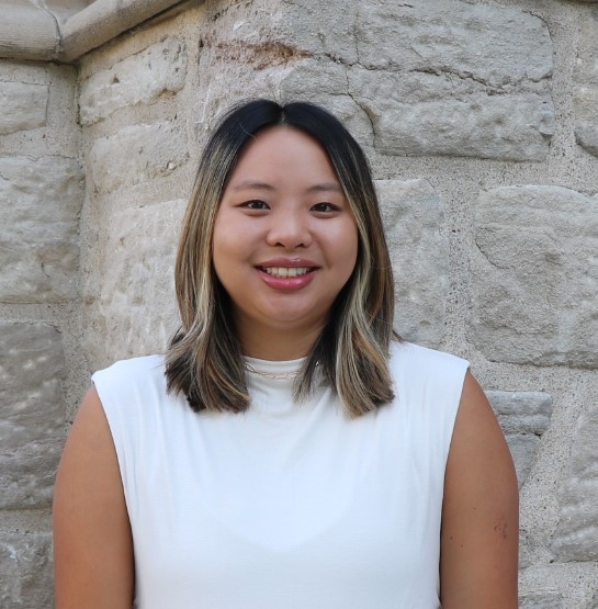 A student poses for a portrait. 