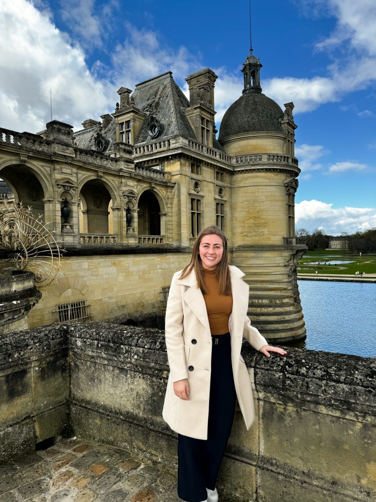 A student poses for a photo in France. 