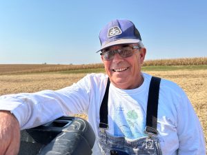 Portrait of Blake Hurst in a field.