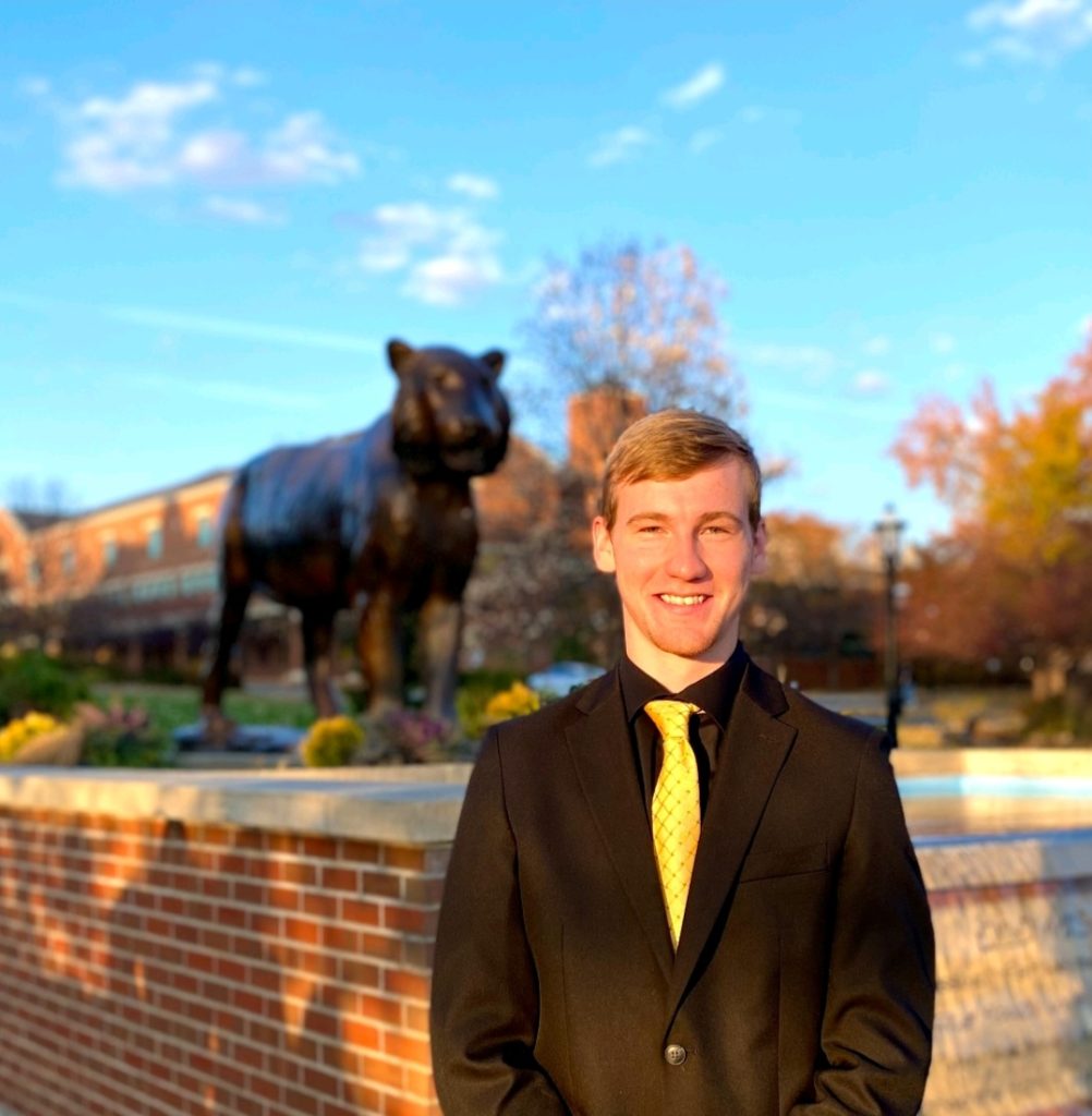 A student poses for a portrait. 