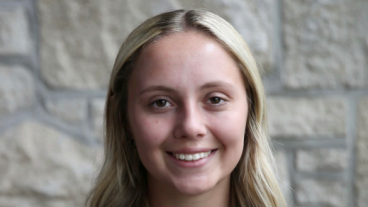 A student poses for a portrait.