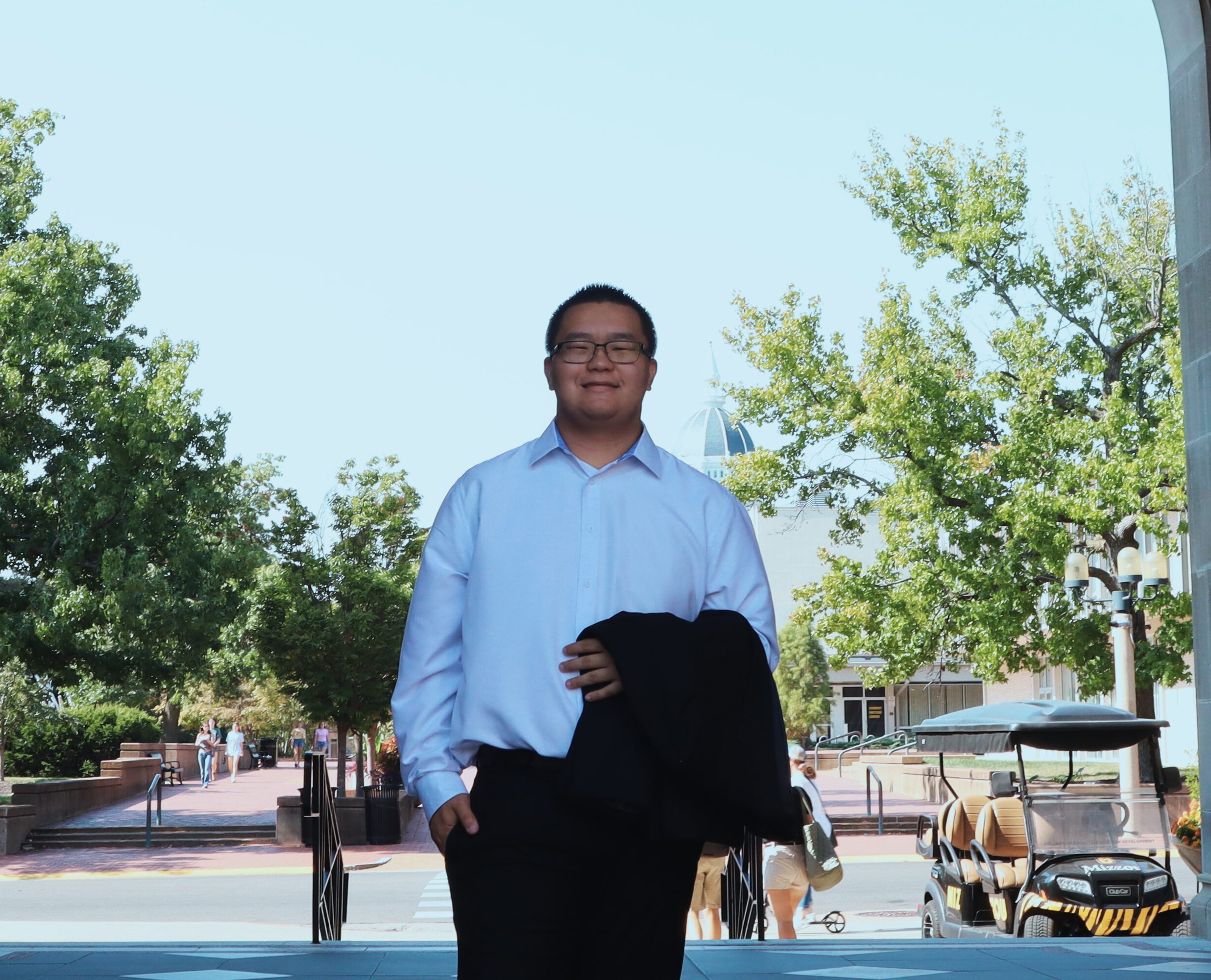 A student poses for a portrait. 