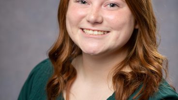 A student poses for a portrait.