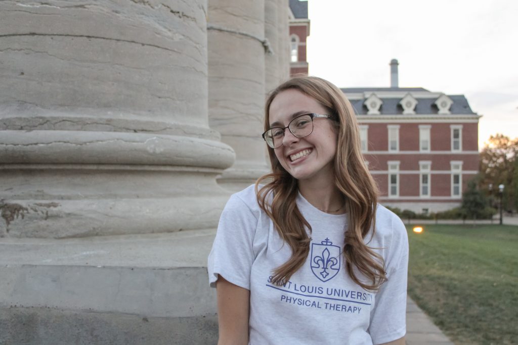 A student poses for a portrait. 