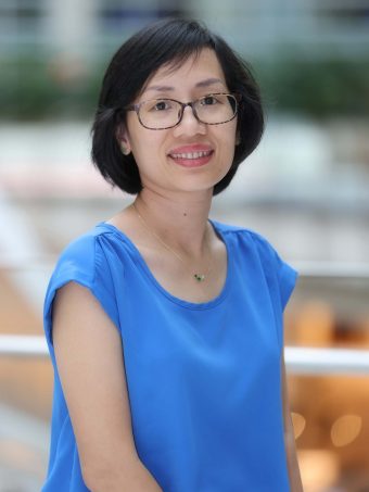 A woman poses for a head shot.