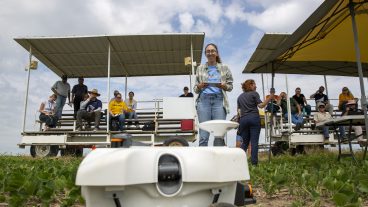 field day participant drives a robotic tool in the field