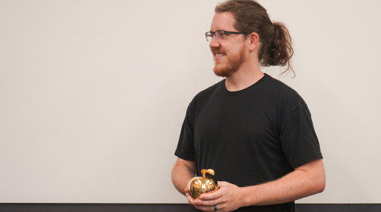Adam Yokom, assistant professor of Biochemistry, receives Golden Apple&nbsp;Award (click to read)