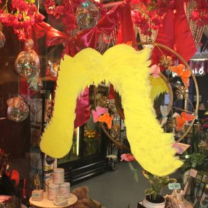 Dolly Parton's iconic hair painted on a window display.