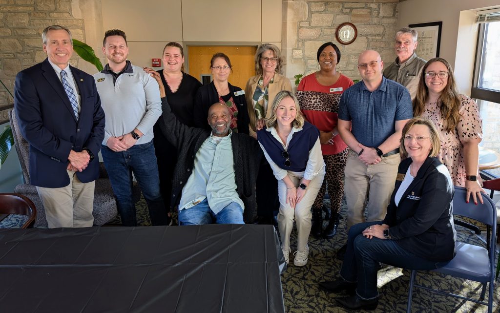 People posing and smiling.