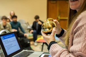Stephanie Gates holds her Golden Apple Award.