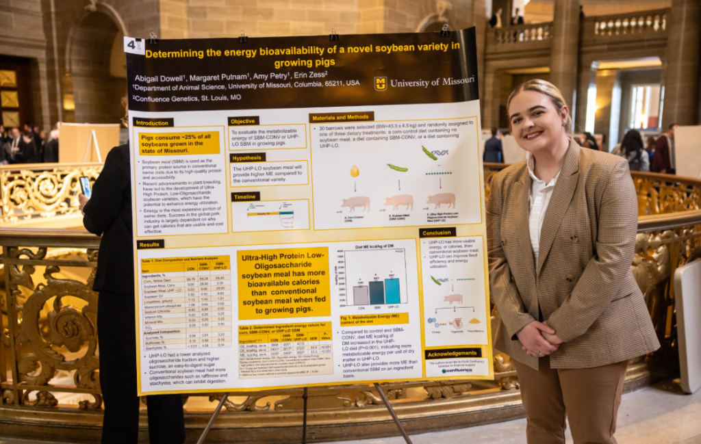 Abigail Dowell with research poster at State Capitol.