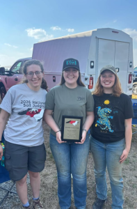 Three Mizzou students and members of Mizzou's Soil Judging Team hold second place award.