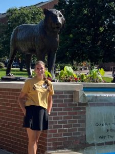 Gentrie Davis in front of Tiger statue on the Mizzou campus.