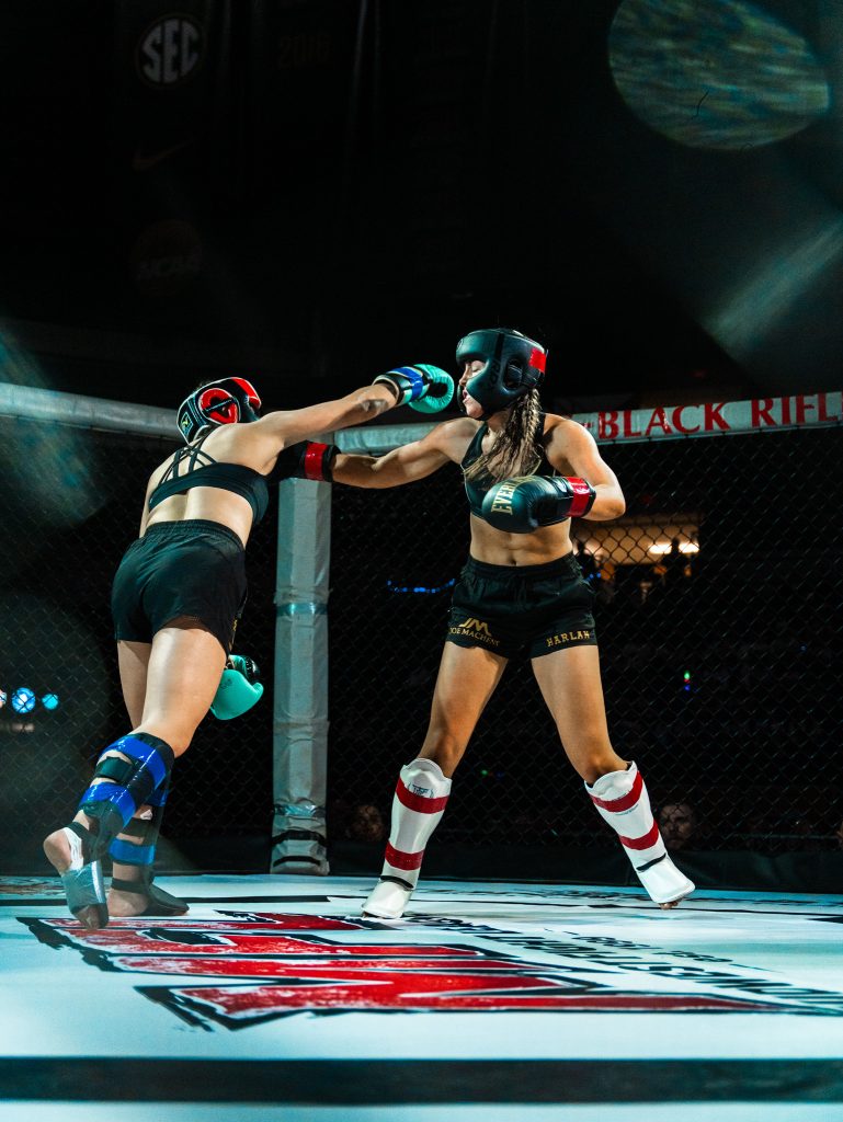 Lauren LaMar throwing a punch at her opponent in the ring during Mizzou's Fight Night 2026.