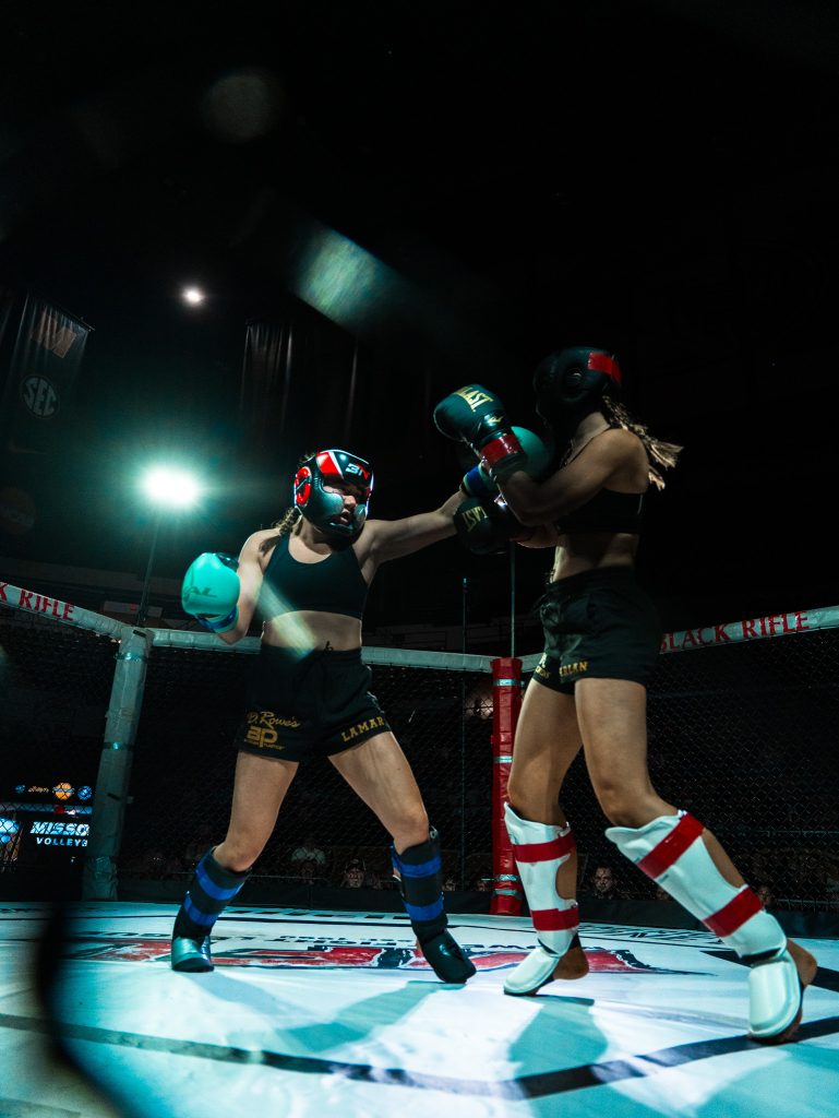 Lauren LaMar throws a punch at her opponent in the ring during Mizzou's Fight Night 2026.