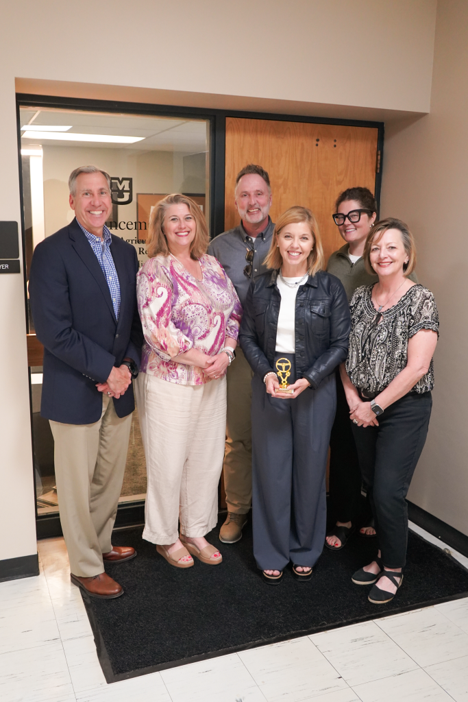 The Advancement team poses with the Dean.