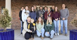 Brennan Greenwell (fourth from left) with CAFNR Dean Christopher Daubert and coworkers at the Farm for Soy Innovation.