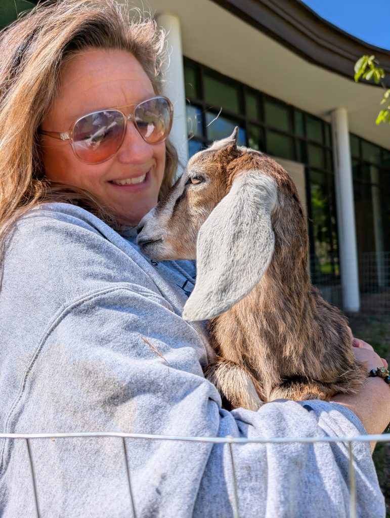 Jennifer holding goat.