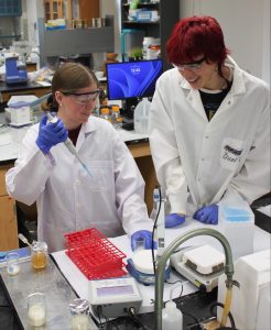 Oscar Bomgaars laughs with lab partner.