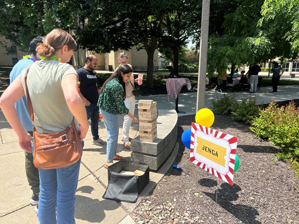 Attendees try their hand at giant Jenga.