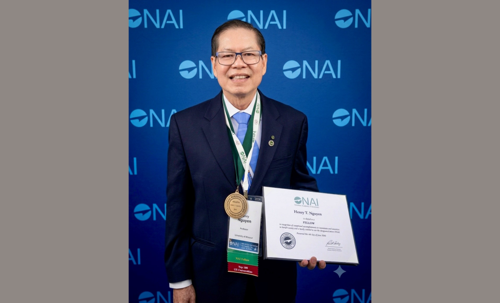 Henry Nguyen with his certificate and medal for induction into the National Academy of Inventors.
