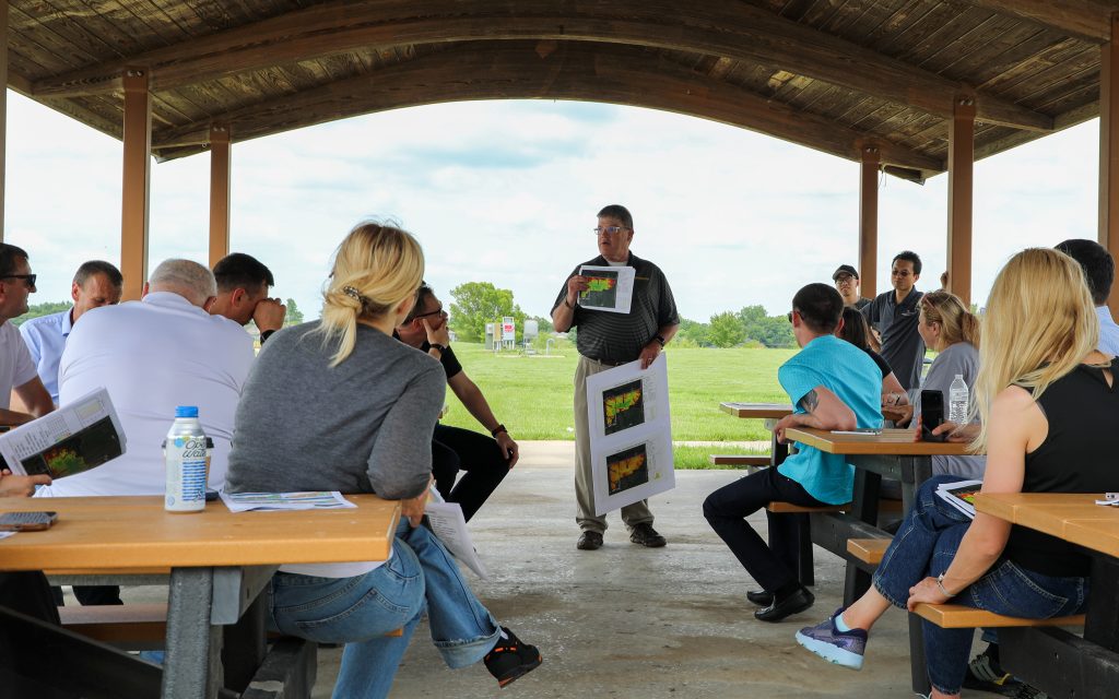 A group looks at soil maps.