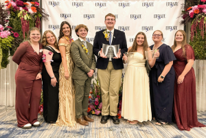 Student members of the Mizzou chapter of the American Institute of Floral Designers (AIFD) pose with awards after placing second overall at the 2026 national competition.
