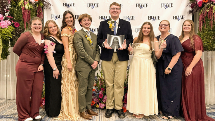 Student members of the Mizzou chapter of the American Institute of Floral Designers (AIFD) pose with awards after placing second overall at the 2026 national competition.